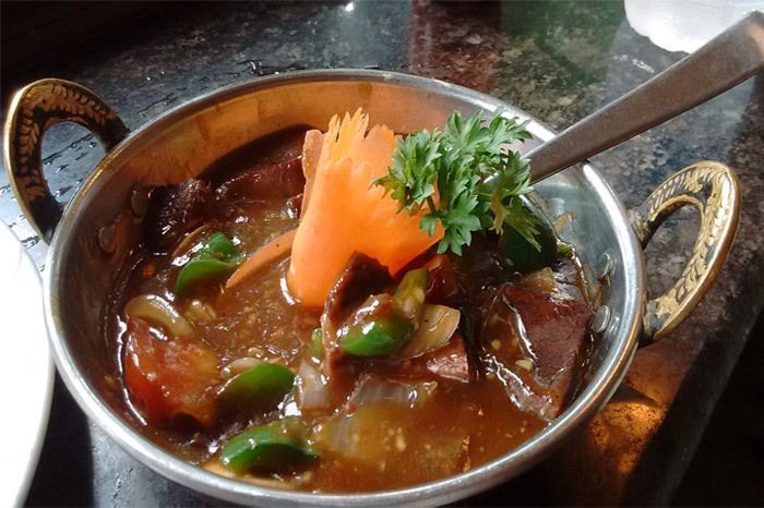 Sliced Buffalo with Mushroom Oyster Sauce at Dolma House; Photographed by Lucas Batista